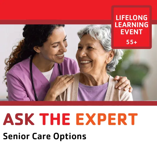 A friendly nurse talking to an older woman.