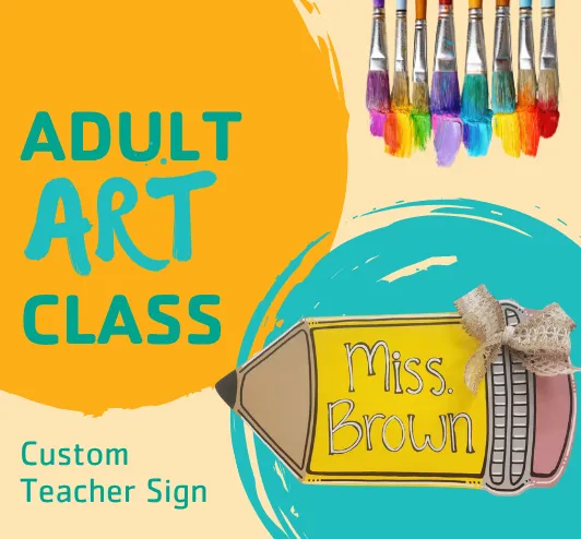 A wooden sign in the shape of a pencil that reads "Miss Brown"